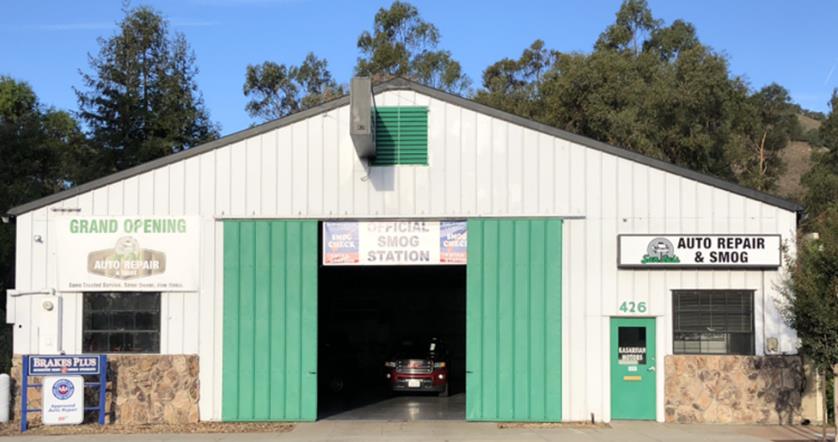 A garage with a car parked in it.